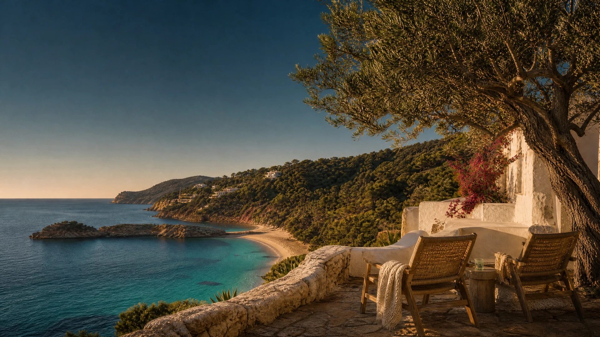 Wide Cala Tarida bay with white sand, turquoise water and pine slopes